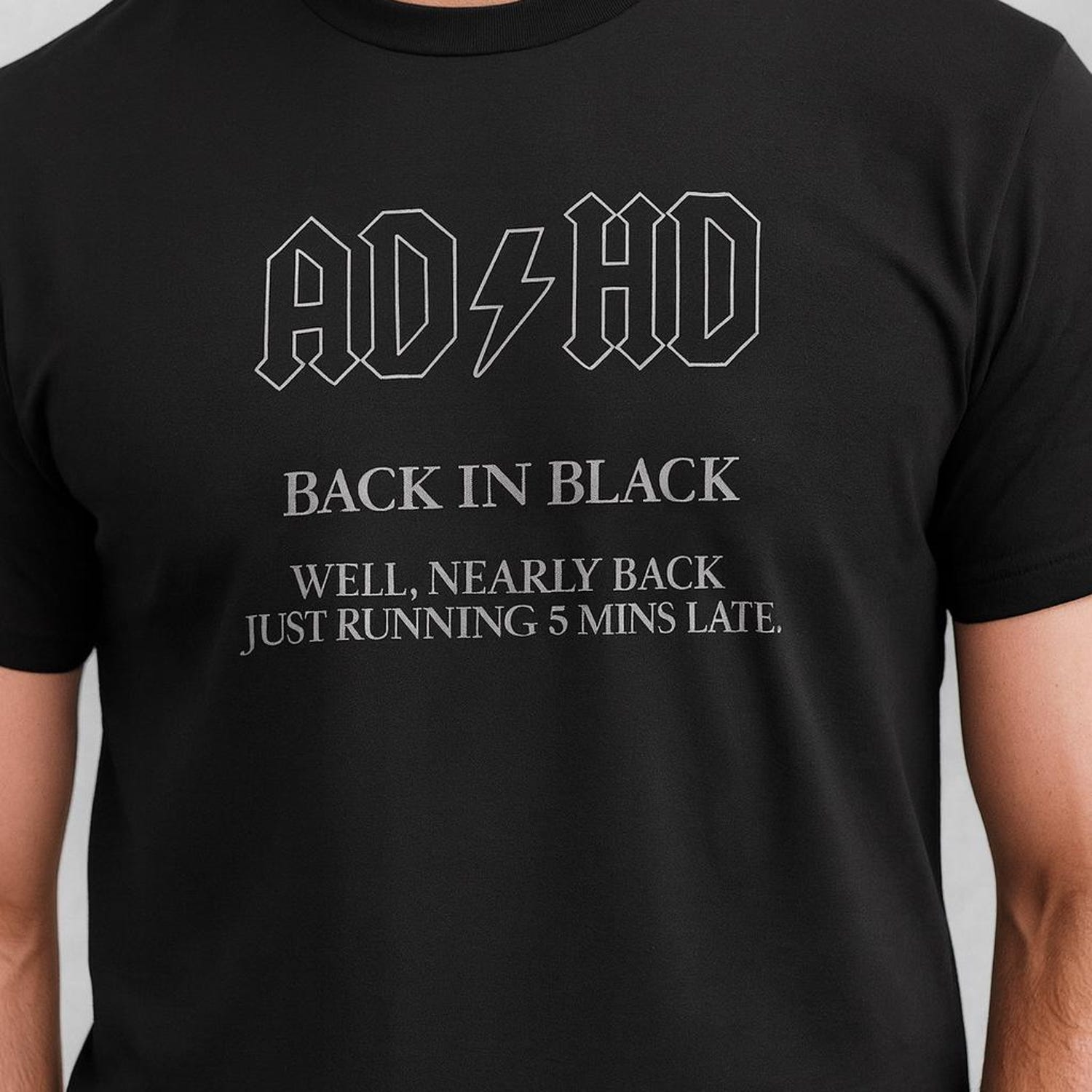 'ADHD Back In Black' Funny Quote Tee - Neurodivergent Humor Graphic Shirt